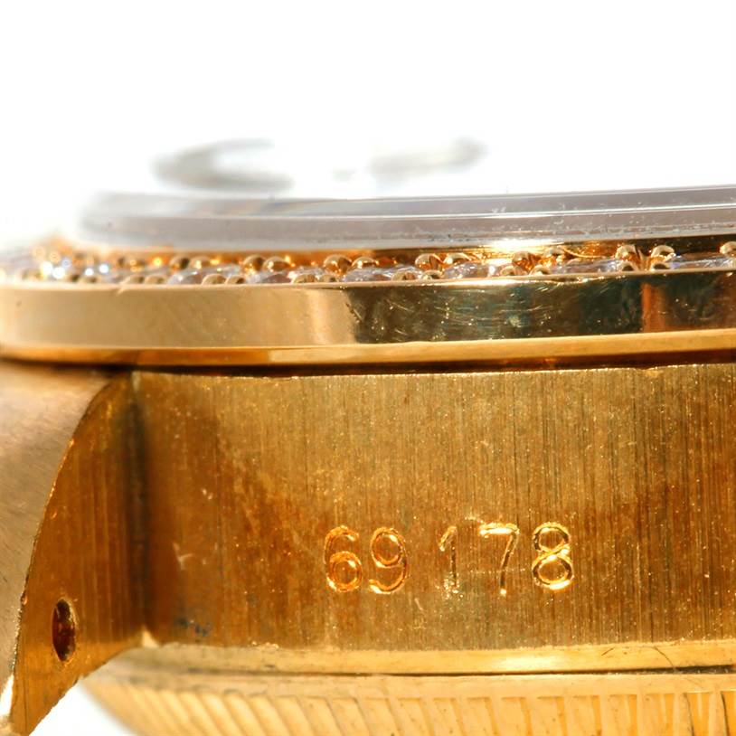 The image shows a close-up of the case side and bezel of a Rolex President 69178 Women's Yellow Gold Mother of Pearl Dial 69178 Women's Yellow Gold Mother of Pearl Dial model, with focus on the serial number.