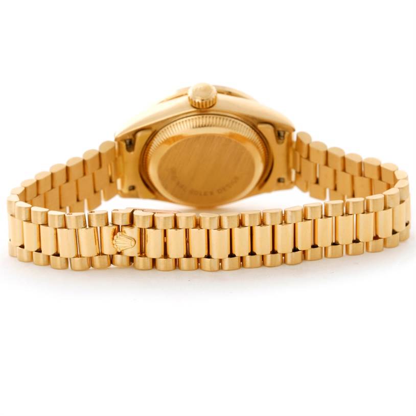 This image shows the back of a Rolex President 69178 Women's Yellow Gold Mother of Pearl Dial 69178 Women's Yellow Gold Mother of Pearl Dial model watch, highlighting its gold case back and bracelet.