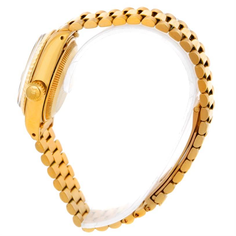 The image shows a side view of the Rolex President 6917 Women's Yellow Gold Champagne Dial 6917 Women's Yellow Gold Champagne Dial model watch highlighting its golden case, crown, and bracelet.