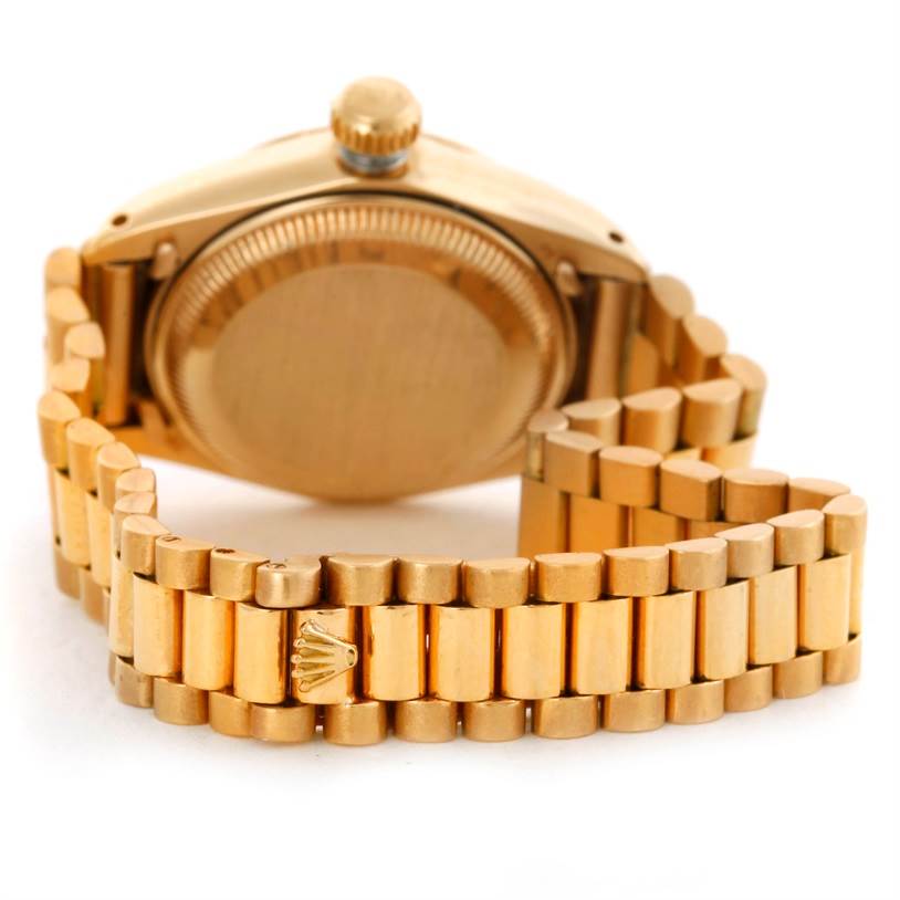 This image shows the backside and bracelet of a Rolex President 6917 Women's Yellow Gold Champagne Dial 6917 Women's Yellow Gold Champagne Dial model watch, focusing on the clasp and case back.