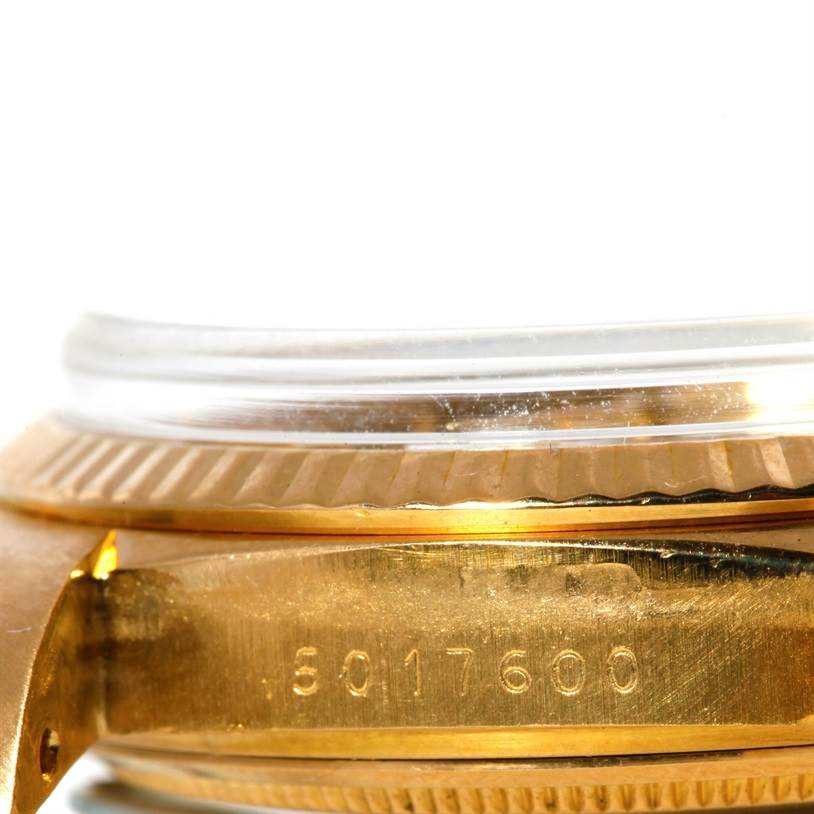 The image shows a close-up of the case side and engraved serial number of the Rolex President 1803 Men
s Yellow Gold Silver Dial 1803 Men
s Yellow Gold Silver Dial model watch.