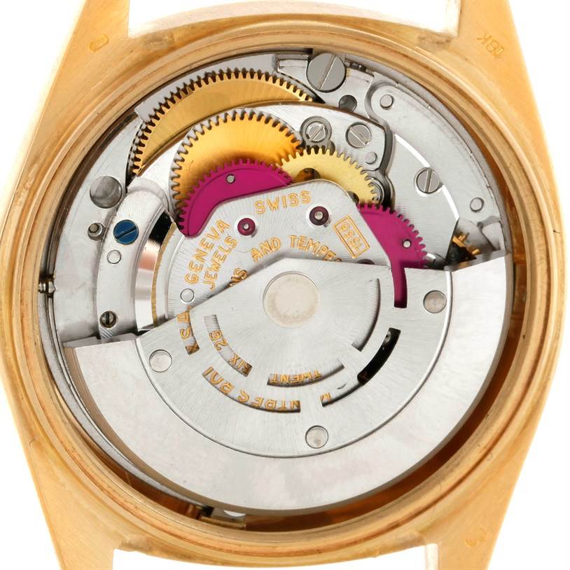 The image shows a detailed internal view of the movement of a Rolex President 1803 Men
s Yellow Gold Silver Dial 1803 Men
s Yellow Gold Silver Dial model watch, highlighting gears and mechanical components.