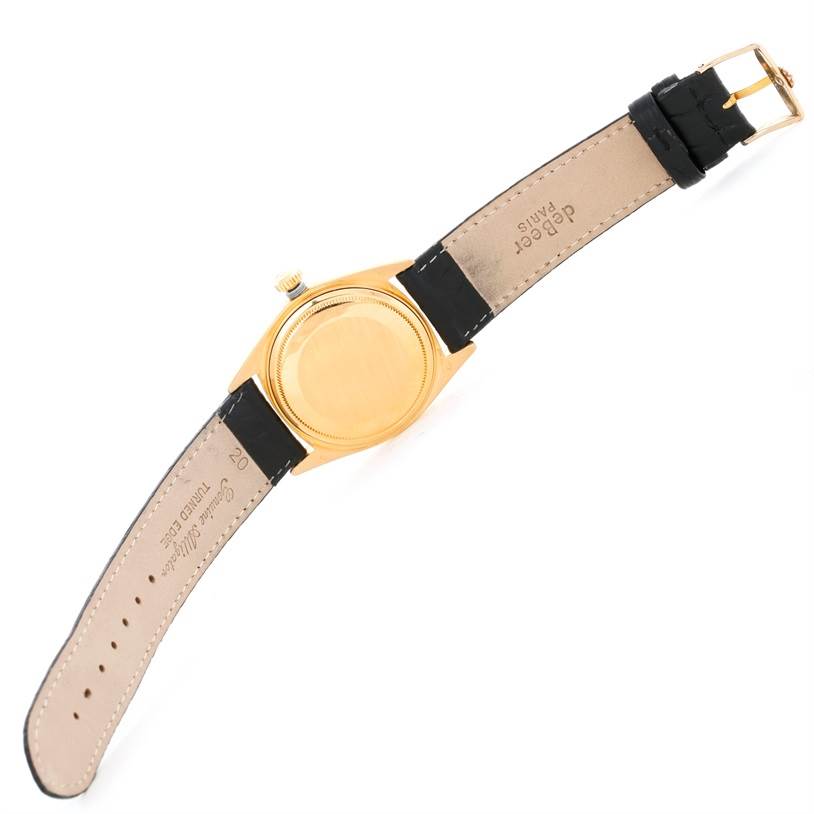 The image shows the back case and leather strap of a Rolex President 1803 Men
s Yellow Gold Silver Dial 1803 Men
s Yellow Gold Silver Dial model watch.