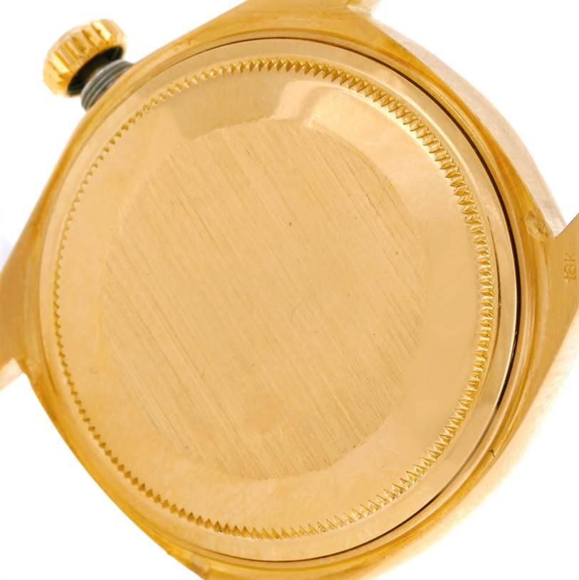 This image shows the back casing and crown of the Rolex President 1803 Men
s Yellow Gold Silver Dial 1803 Men
s Yellow Gold Silver Dial model watch.