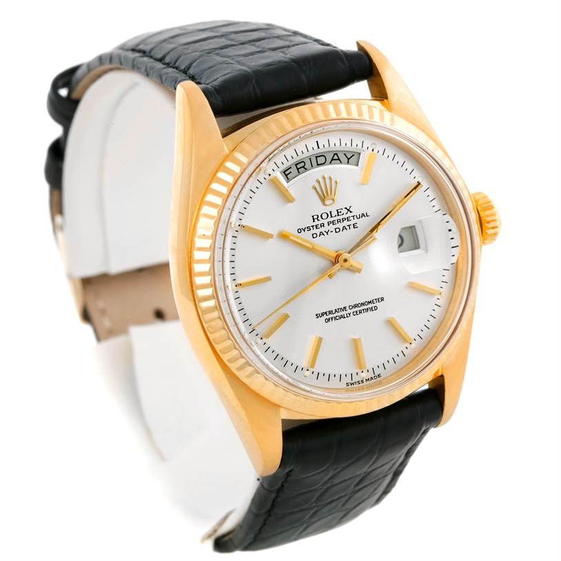 The Rolex President 1803 Men
s Yellow Gold Silver Dial 1803 Men
s Yellow Gold Silver Dial model watch is shown at a three-quarter angle, featuring its face, bezel, and black strap.