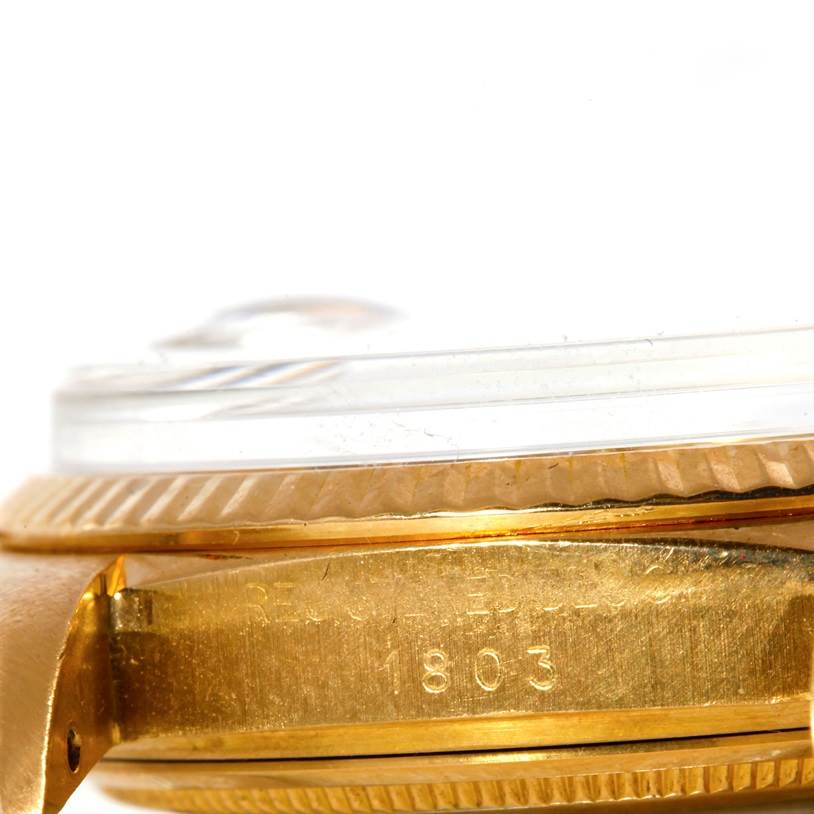 The image shows a close-up side view of the case and bezel of the Rolex President 1803 Men
s Yellow Gold Silver Dial 1803 Men
s Yellow Gold Silver Dial Model 1803.