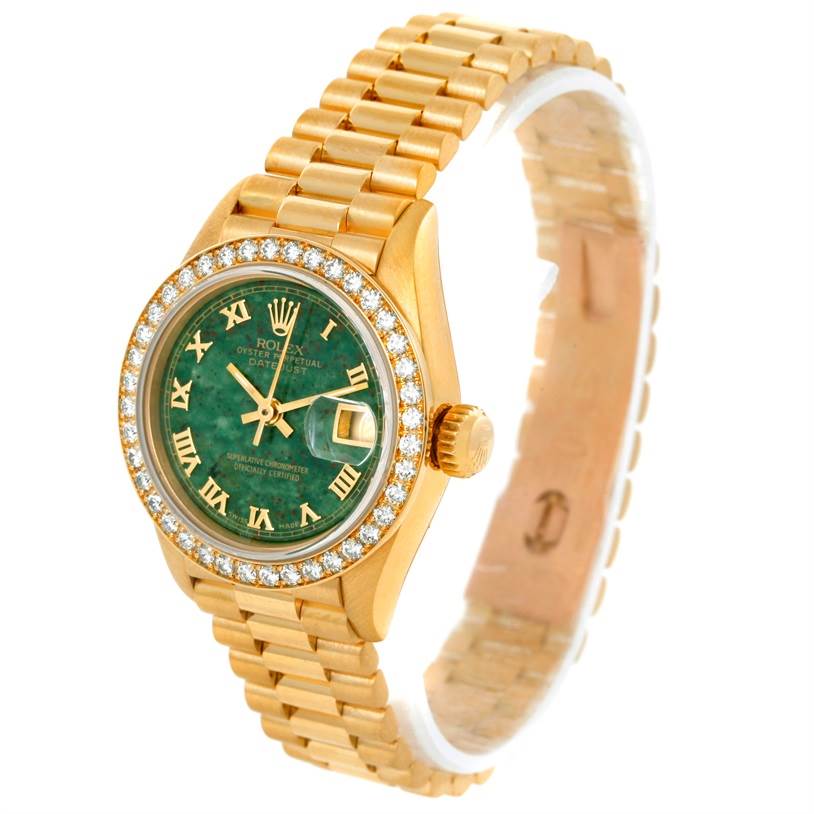The Rolex President 69178 Women's Yellow Gold Green Dial 69178 Women's Yellow Gold Green Dial model is shown at a slight angle, displaying its green dial, gold bracelet, diamond bezel, and date window.