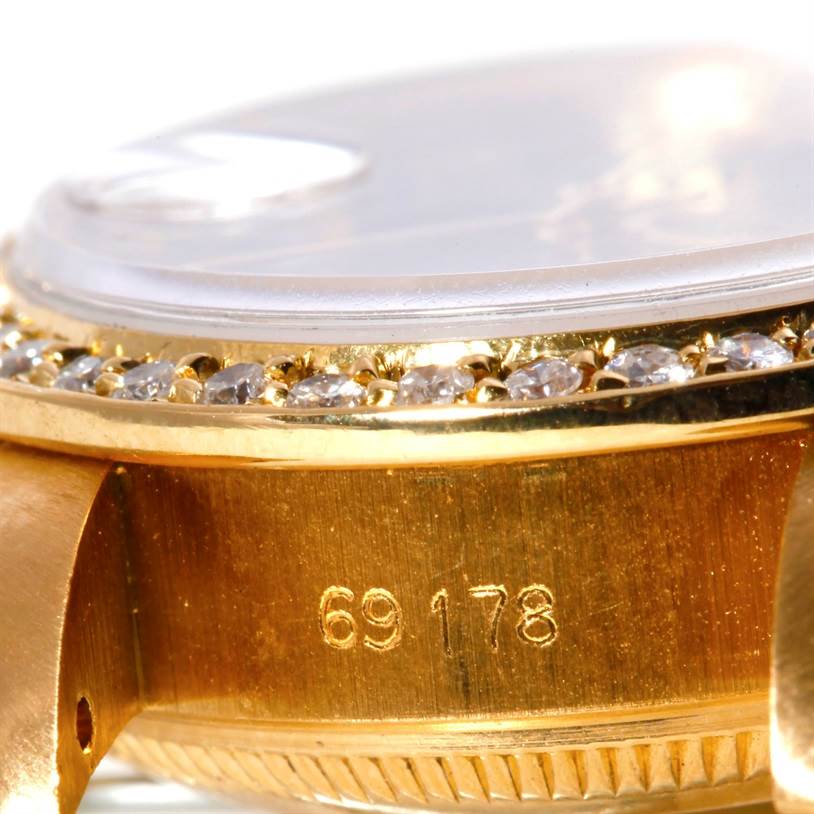 This image shows a close-up of the side case, bezel, and crystal of a Rolex President 69178 Women's Yellow Gold Green Dial 69178 Women's Yellow Gold Green Dial model watch.