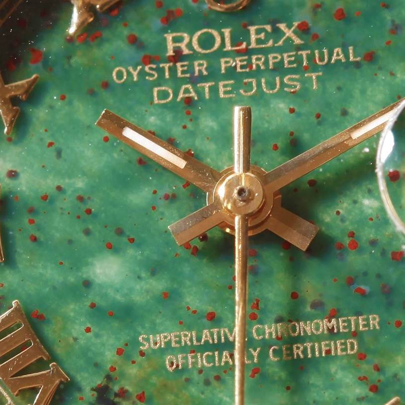 The image shows a close-up view of the dial and hands of a Rolex President 69178 Women's Yellow Gold Green Dial 69178 Women's Yellow Gold Green Dial Oyster Perpetual Datejust watch.