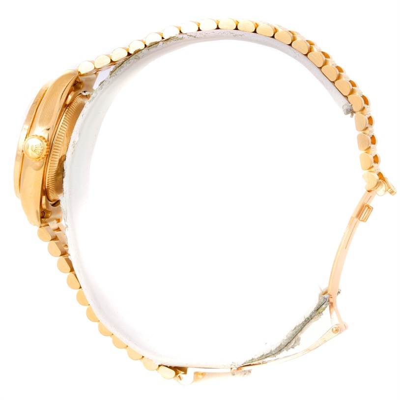The image shows a side view of a Rolex President 69288 Women's Yellow Gold White Dial 69288 Women's Yellow Gold White Dial model watch, highlighting its gold case and linked bracelet.