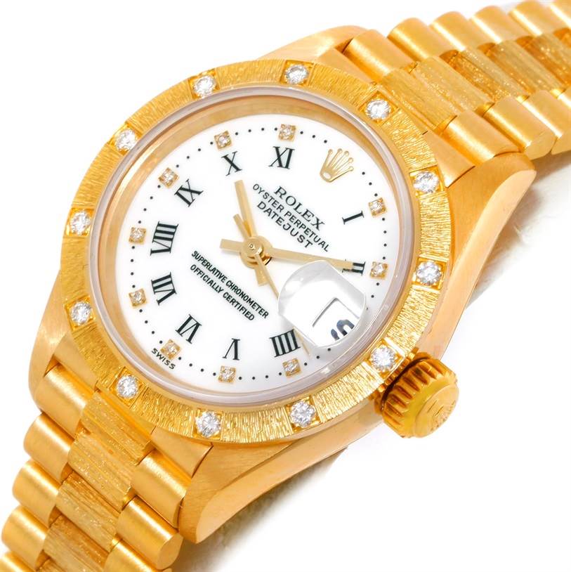 The angled image shows the face, bezel, crown, and part of the band of a Rolex President 69288 Women's Yellow Gold White Dial 69288 Women's Yellow Gold White Dial model watch.