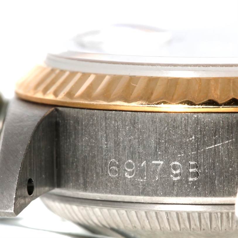 Close-up side view of the Rolex President 69179B Women's White Gold Brown Dial 69179B Women's White Gold Brown Dial model showing the bezel, case, and part of the lug with model number 69179B engraved.