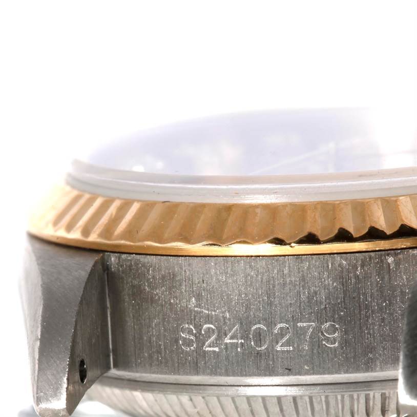 The image shows a close-up side view of the casing and bezel of the Rolex President 69179B Women's White Gold Brown Dial 69179B Women's White Gold Brown Dial model watch, displaying its serial number.