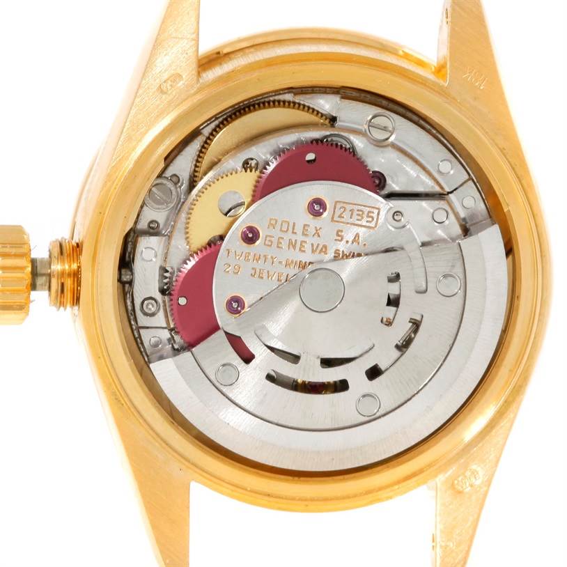 This image shows the internal mechanical movement of the Rolex President 69178 Women's Yellow Gold Champagne Dial 69178 Women's Yellow Gold Champagne Dial watch model, revealing gears and the winding mechanism.