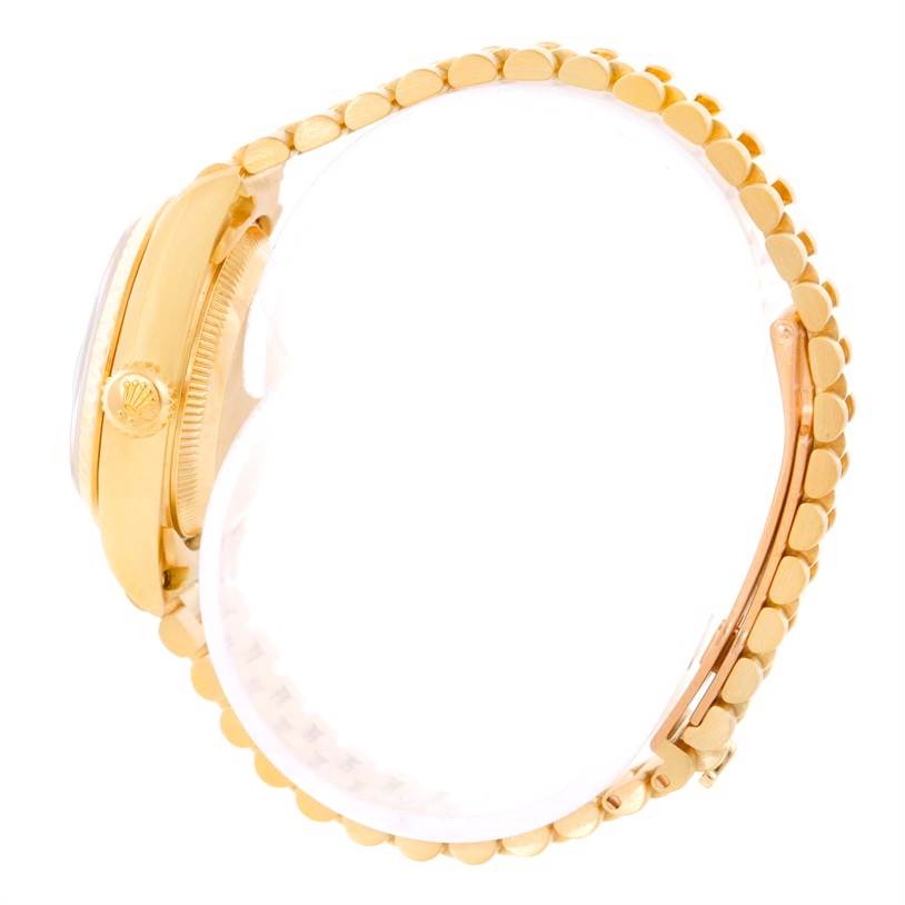 This image shows a side view of a Rolex President 69178 Women's Yellow Gold Black Dial 69178 Women's Yellow Gold Black Dial model watch, highlighting its crown, case, and bracelet.