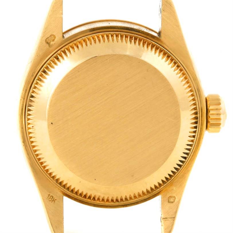 This image shows the case back and crown of a Rolex President 69178 Women
s Yellow Gold Beige Dial 69178 Women
s Yellow Gold Beige Dial model watch from a rear angle.
