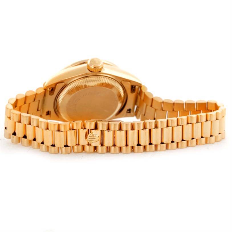 This image shows the back and bracelet of a Rolex President 69178 Women's Yellow Gold Black Dial 69178 Women's Yellow Gold Black Dial model watch, with a focus on the clasp and caseback.