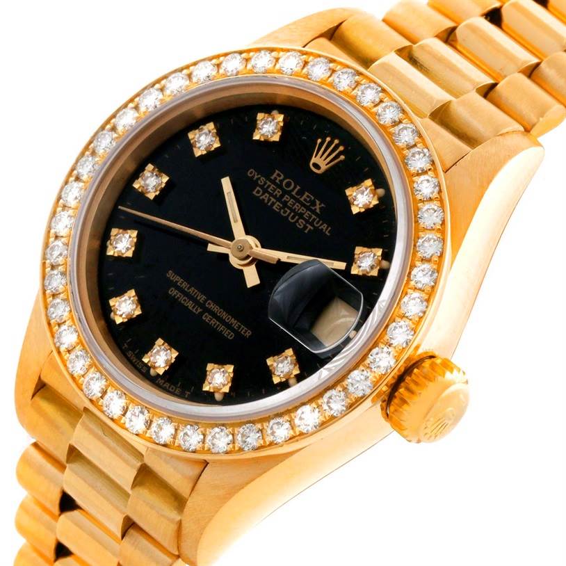 The image shows a close-up of a Rolex President 69178 Women's Yellow Gold Black Dial 69178 Women's Yellow Gold Black Dial model watch highlighting its diamond bezel, black dial, and gold bracelet.