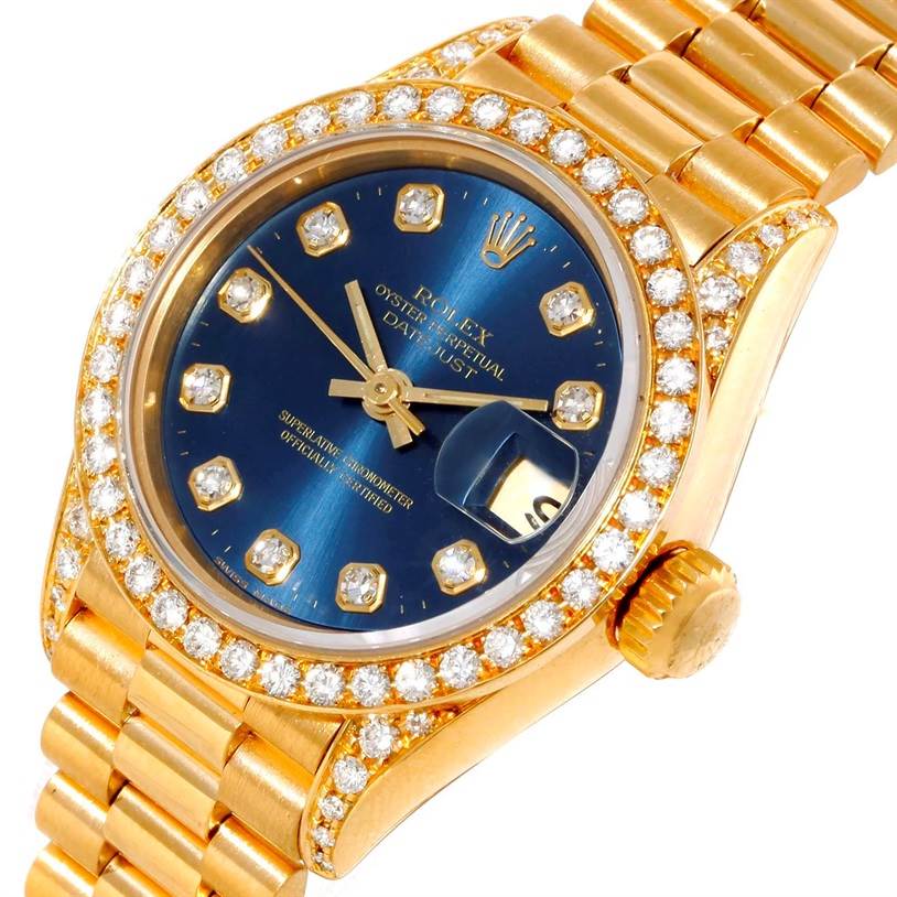 This is a close-up of a gold Rolex President 69188 Women's Yellow Gold Blue Dial 69188 Women's Yellow Gold Blue Dial model watch showcasing the dial, bezel, and part of the bracelet.