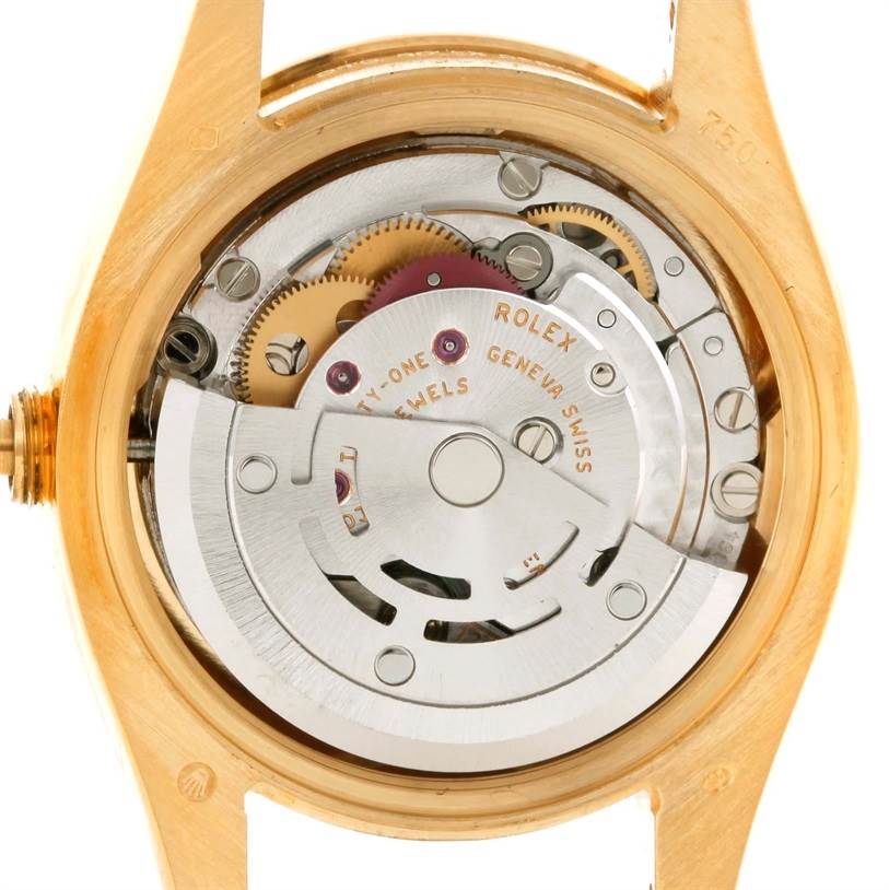 The image shows the back view of the Rolex President 179298 Women's Yellow Gold Silver Dial 179298 Women's Yellow Gold Silver Dial watch, revealing its internal movement and mechanical parts.