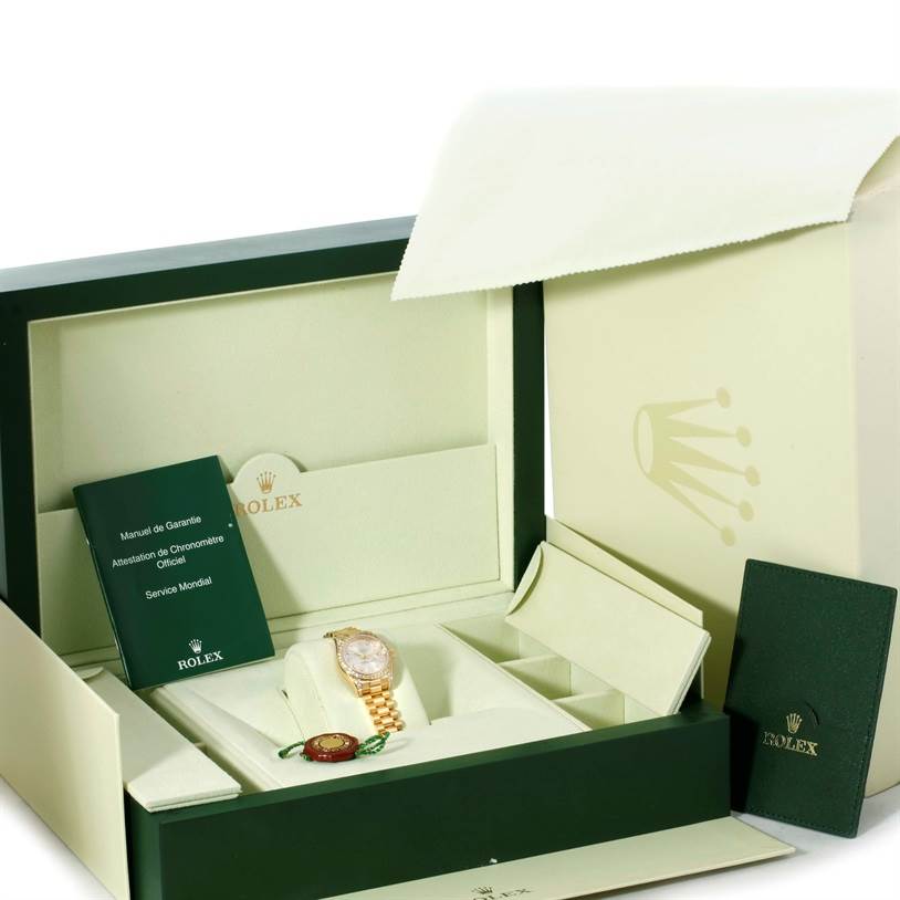 The image shows an open box of a Rolex President 179298 Women's Yellow Gold Silver Dial 179298 Women's Yellow Gold Silver Dial model watch, with its certificate and tag also displayed.