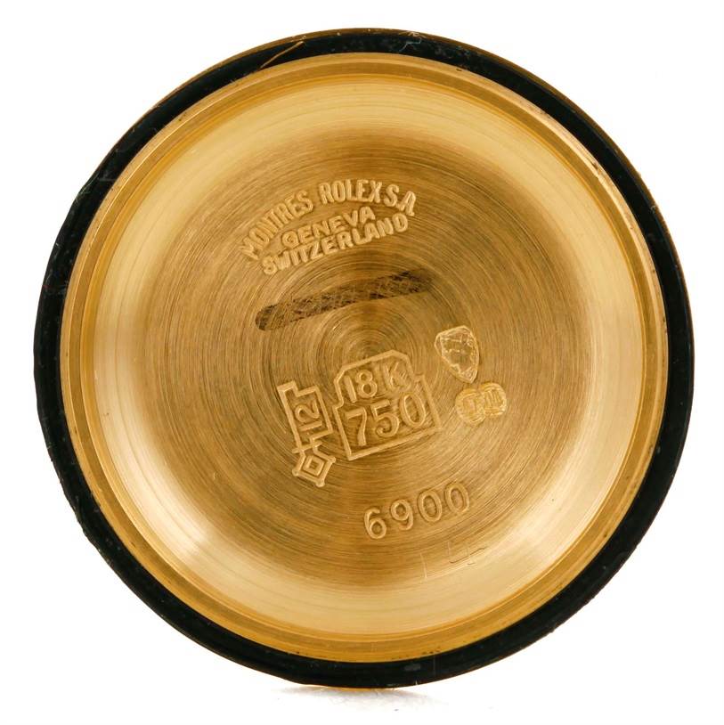 This image shows the interior of the case back of a Rolex President 6917 Women's Yellow Gold Champagne Dial 6917 Women's Yellow Gold Champagne Dial model, showcasing inscriptions and hallmarks.