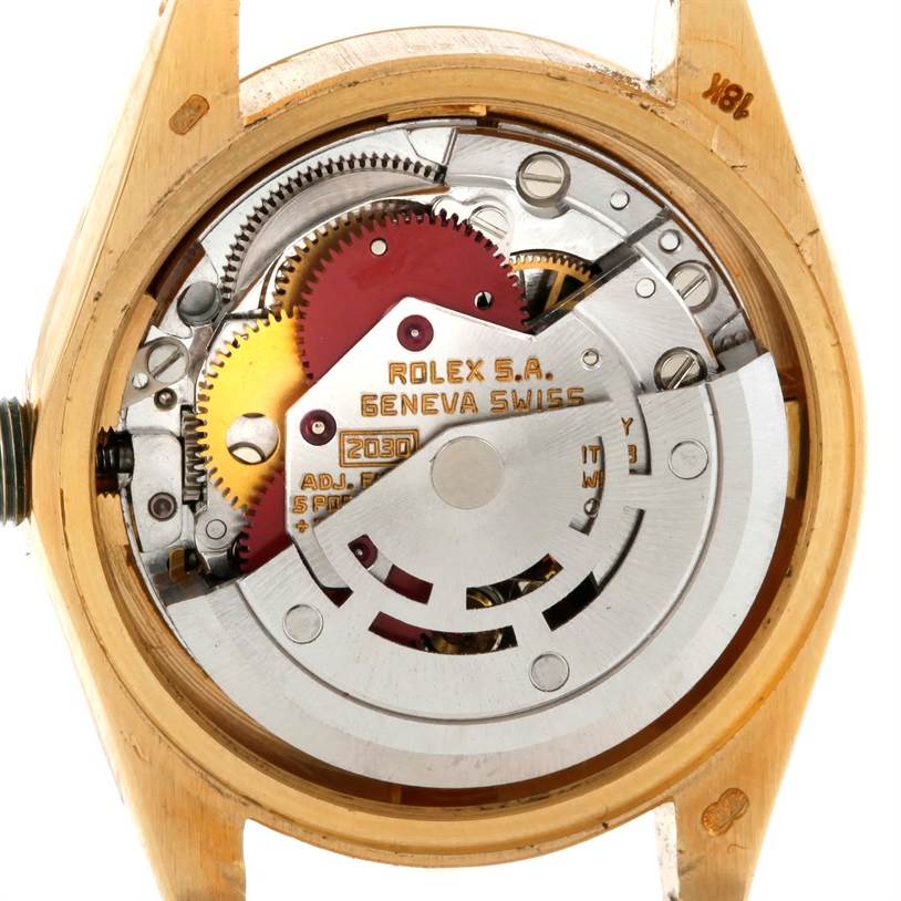 The image shows the inner movement and gears of a Rolex President 6917 Women's Yellow Gold Champagne Dial 6917 Women's Yellow Gold Champagne Dial model watch viewed from the back.