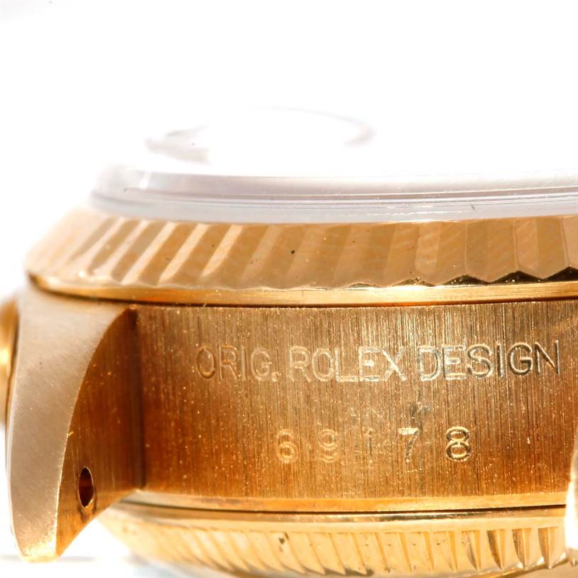 The image shows a close-up side view of the bezel and lugs of a Rolex President 69178 Women's Yellow Gold Champagne Dial 69178 Women's Yellow Gold Champagne Dial model watch, showcasing "ORIG. ROLEX DESIGN" engraving and model number.