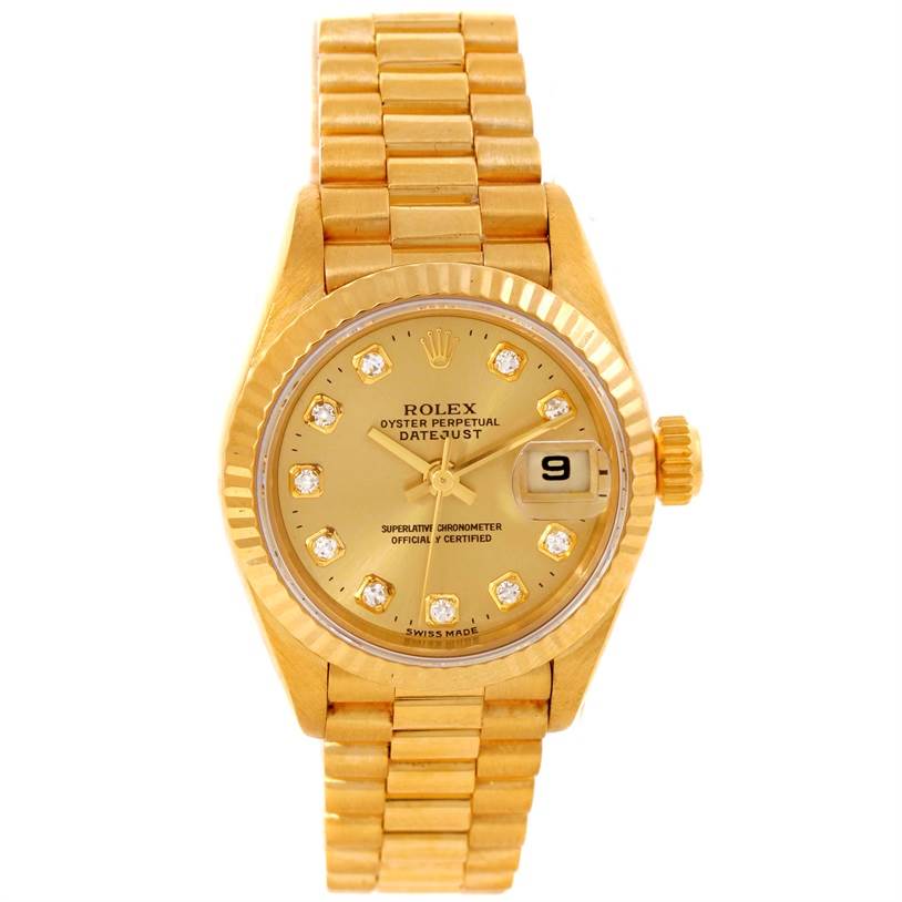 This image shows the President model by Rolex from a top-down angle, featuring its gold bracelet, dial, and date window.