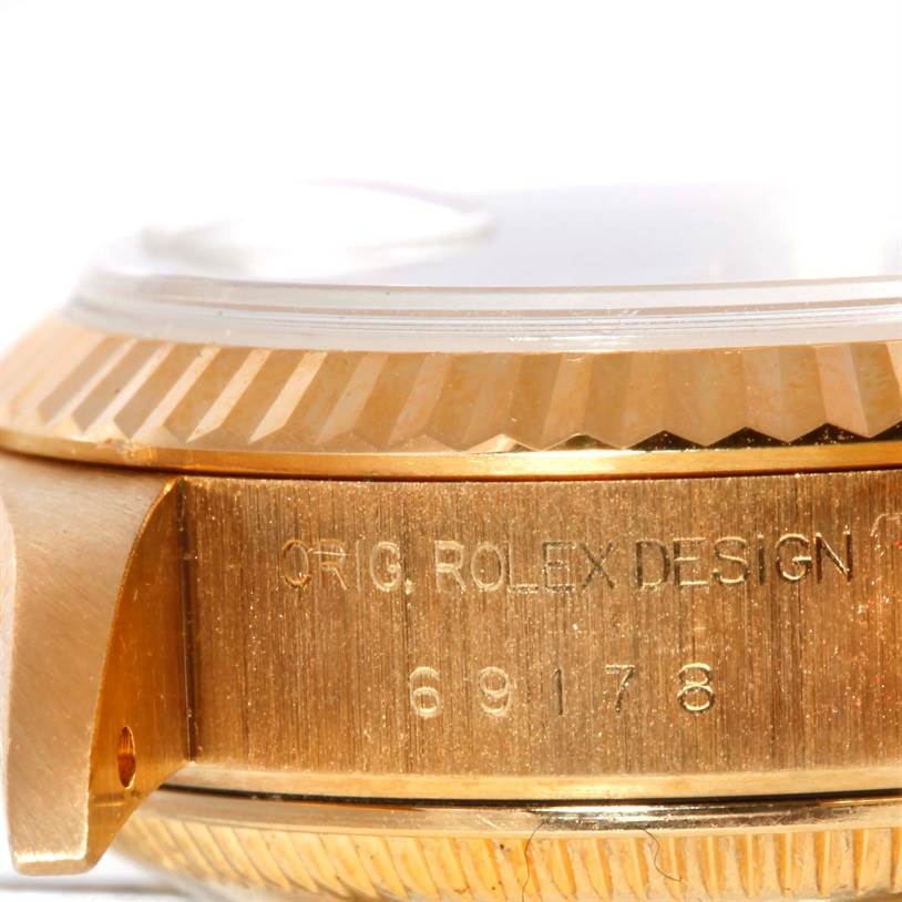 This image shows a close-up side view of the case and bezel of the Rolex President 69178 Women's Yellow Gold Silver Dial 69178 Women's Yellow Gold Silver Dial model watch.