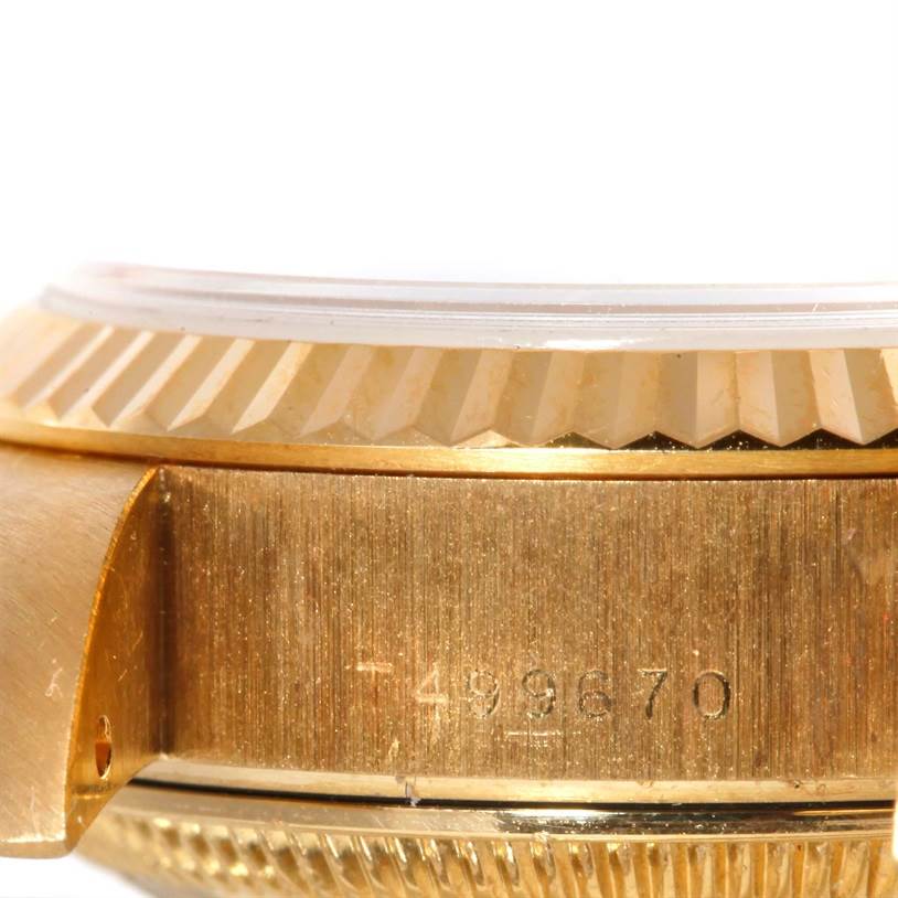 The image shows a close-up side view of the case and bezel of a Rolex President 69178 Women's Yellow Gold Silver Dial 69178 Women's Yellow Gold Silver Dial model watch, featuring the serial number engraved on the case.