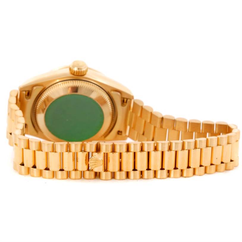 This image shows the backside and bracelet of a Rolex President 69268 Women's Yellow Gold Champagne Dial 69268 Women's Yellow Gold Champagne Dial model watch.