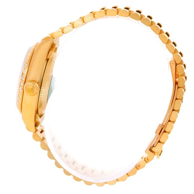 The image shows a side view of the Rolex President 69268 Women's Yellow Gold Champagne Dial 69268 Women's Yellow Gold Champagne Dial model watch, highlighting its gold case, crown, and bracelet.