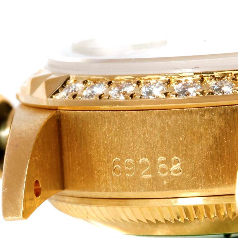 This close-up of the Rolex President 69268 Women's Yellow Gold Champagne Dial 69268 Women's Yellow Gold Champagne Dial watch showcases its side, part of the bezel with diamonds, and the model number 69268.