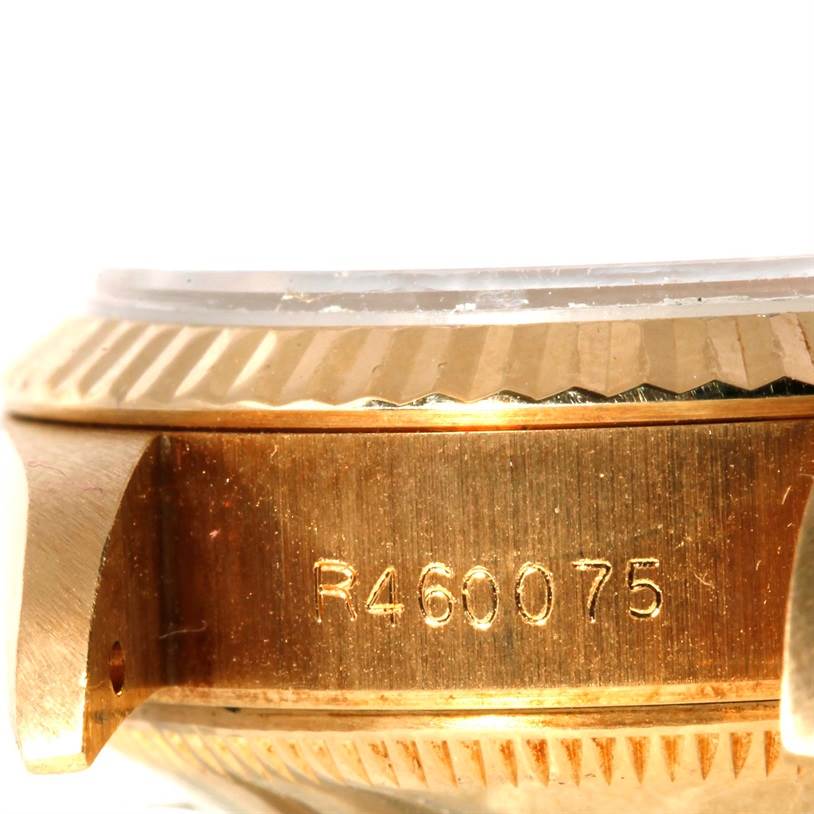This image shows a close-up angle of the case and serial number of a Rolex President 69178 Women's Yellow Gold Champagne Dial 69178 Women's Yellow Gold Champagne Dial model watch.