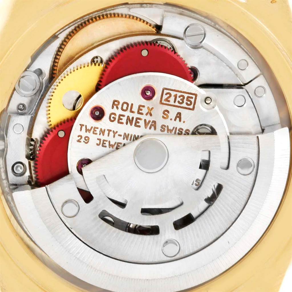 The image shows the internal mechanical movement of a Rolex President 69178 Women
s Yellow Gold Champagne Dial 69178 Women
s Yellow Gold Champagne Dial model watch from a close-up, rear angle.
