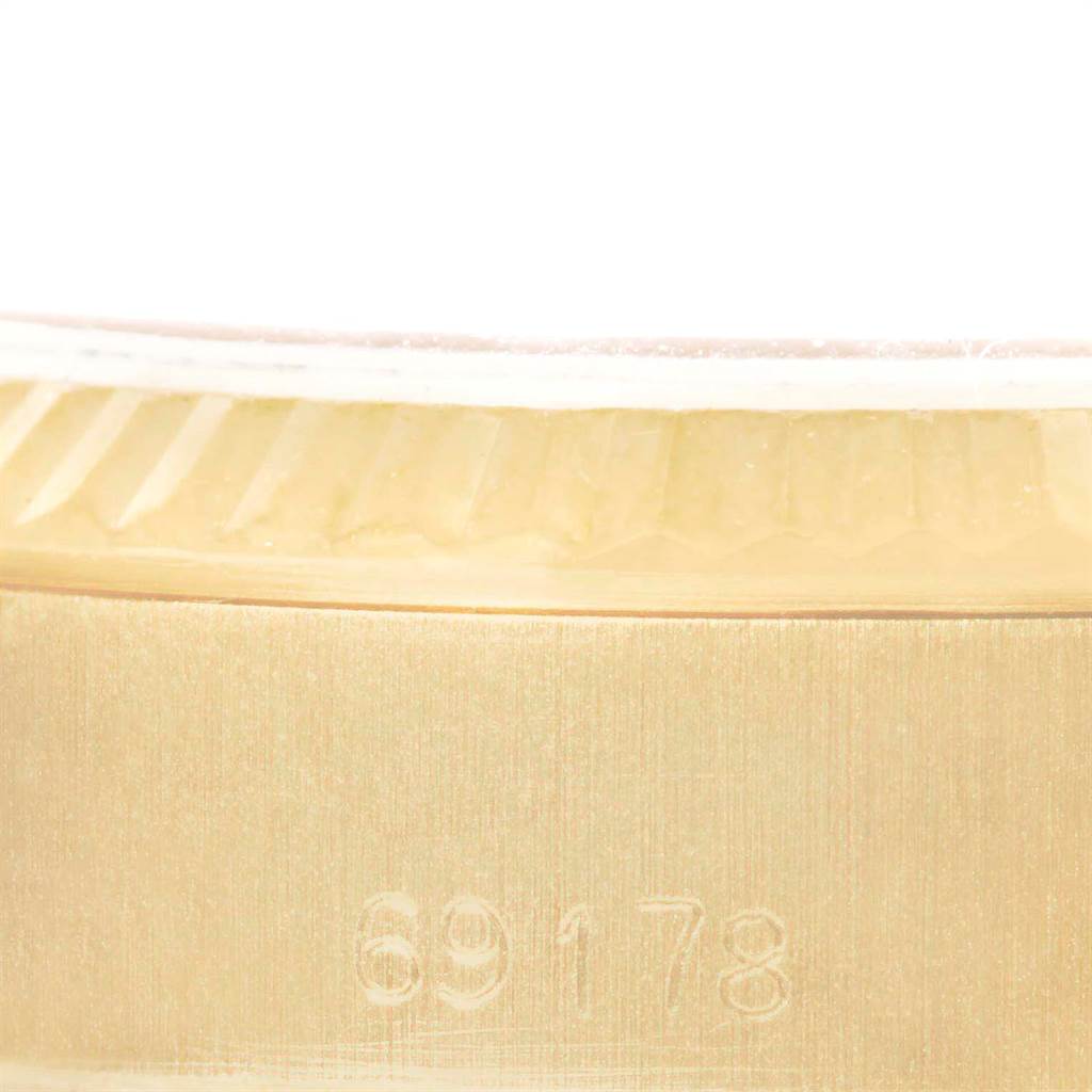 The image shows a close-up of the side of the bezel and case of the Rolex President 69178 Women
s Yellow Gold Champagne Dial 69178 Women
s Yellow Gold Champagne Dial model, highlighting the model number.
