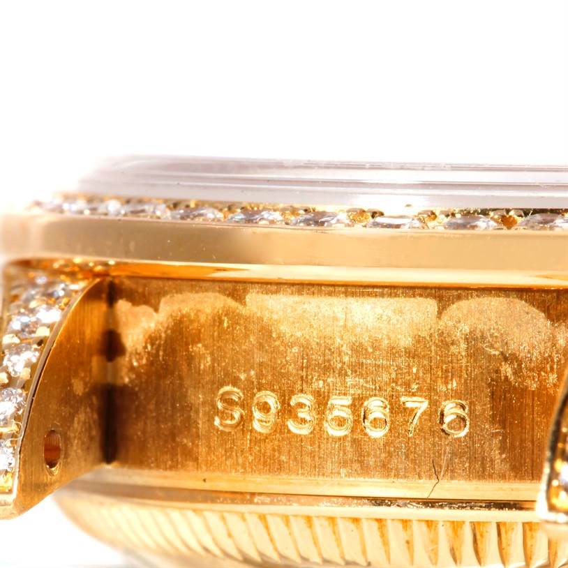 The image shows a close-up side angle of the Rolex President 69238 Women's Yellow Gold Champagne Dial 69238 Women's Yellow Gold Champagne Dial model watch, highlighting the serial number and diamond-encrusted bezel.