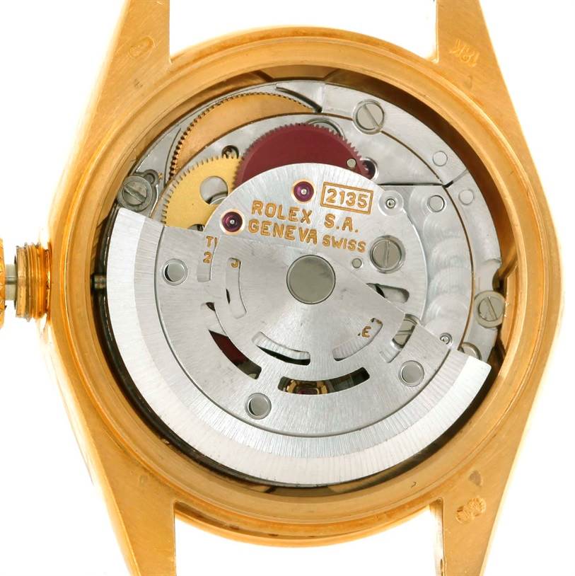 The image shows the internal mechanism of the Rolex President 69238 Women's Yellow Gold Champagne Dial 69238 Women's Yellow Gold Champagne Dial model watch from a back angle, highlighting its intricate components.