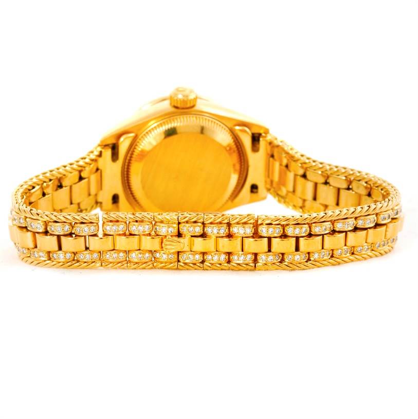 The image shows the back view of a Rolex President 69238 Women's Yellow Gold Champagne Dial 69238 Women's Yellow Gold Champagne Dial model watch, focusing on the bracelet and case back.