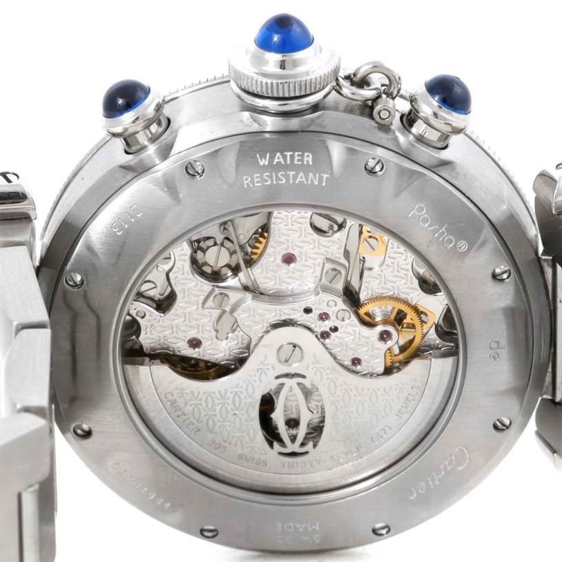 This image shows the back view of the Cartier Pasha W31030H3 Men
s Stainless Steel Silver Dial W31030H3 Men
s Stainless Steel Silver Dial watch, showcasing its exposed movement and winding crown with blue cabochons.