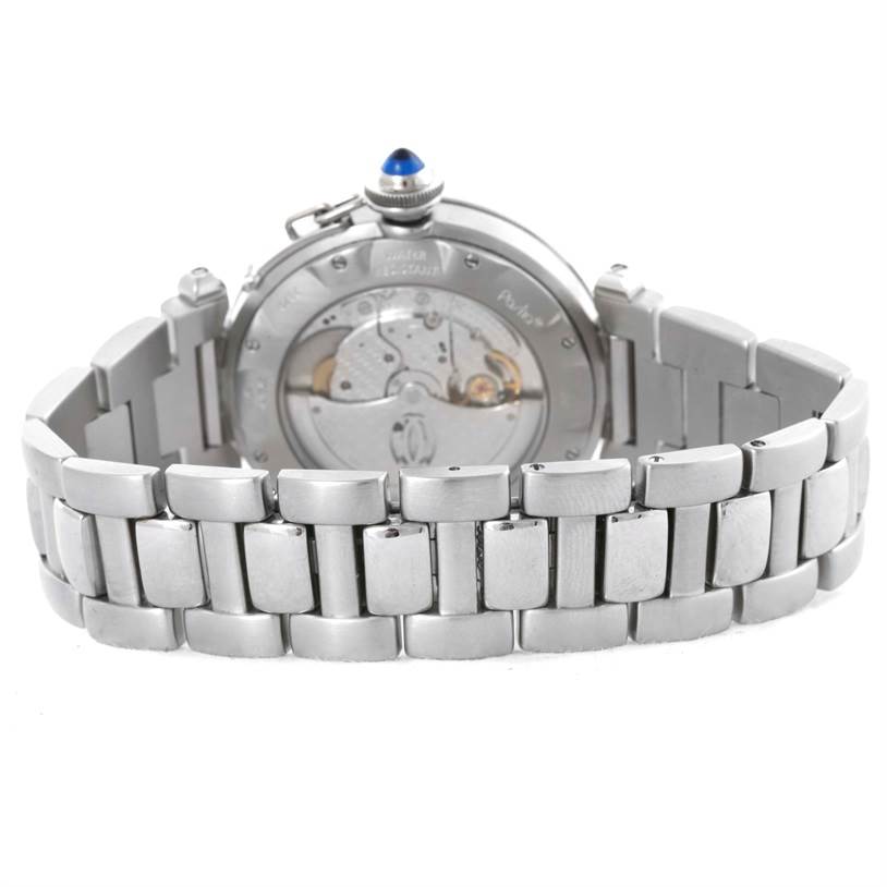 The image shows the back view of a Cartier Pasha W31059H3 Men
s Stainless Steel Silver Dial W31059H3 Men
s Stainless Steel Silver Dial watch, revealing its metal bracelet and the watch
s movement through the transparent case back.