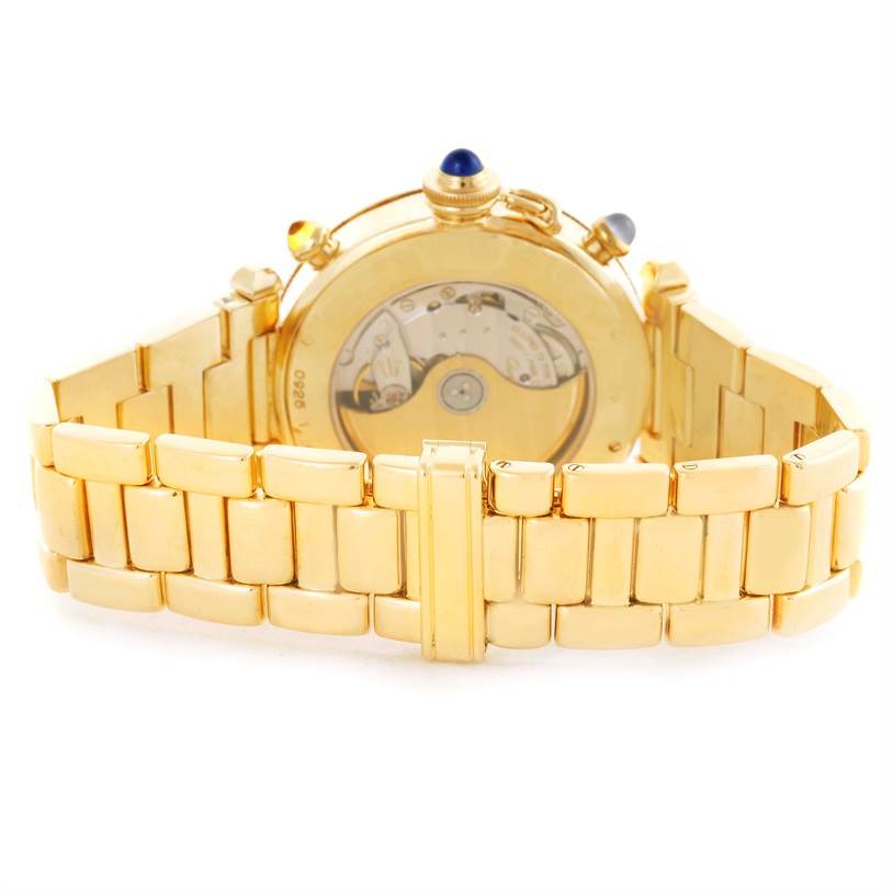 The image shows the back view of a Cartier Pasha M205025 Men's Yellow Gold Silver Dial M205025 Men's Yellow Gold Silver Dial watch, highlighting its gold bracelet and transparent case back.