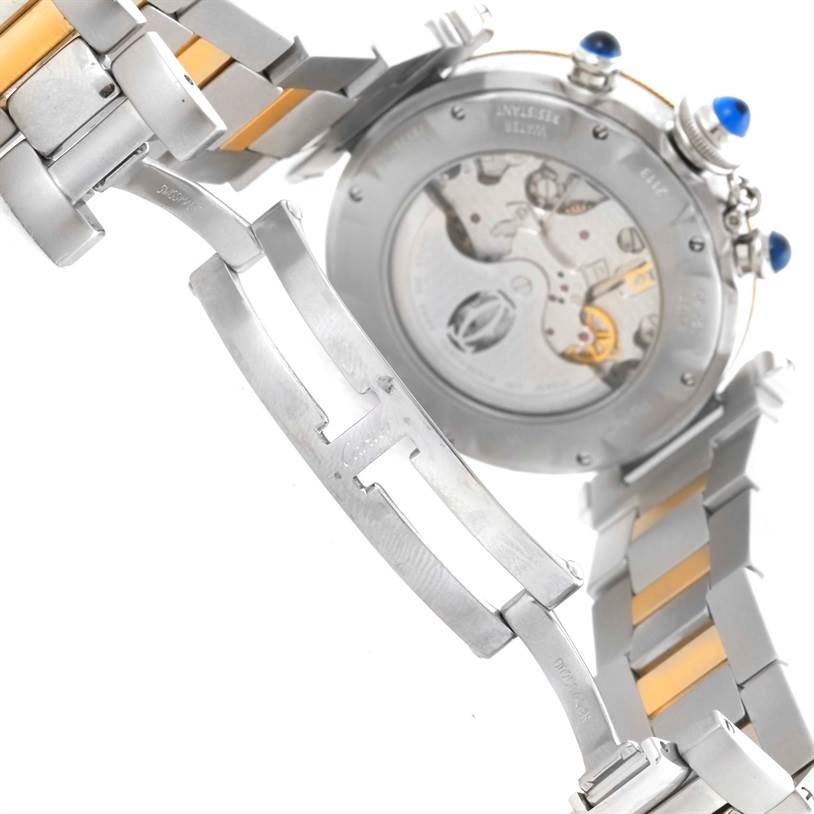 The image shows the back of a Cartier Pasha W31036T6 Stainless Steel Silver Dial W31036T6 Stainless Steel Silver Dial watch, focusing on the movement and part of the metal bracelet.