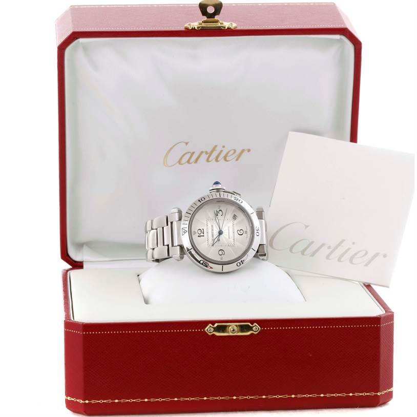 The Cartier Pasha W3103155 Men
s Stainless Steel Silver Dial W3103155 Men
s Stainless Steel Silver Dial watch is displayed in its open red box at a front angle, with its bracelet fully visible.