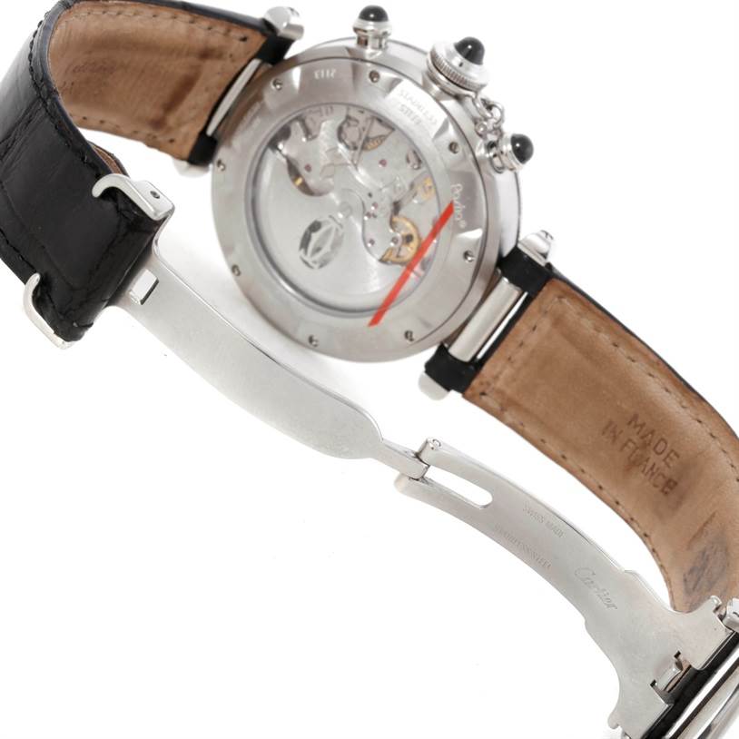 The image shows the backside of the Cartier Pasha W3105155 Men's Stainless Steel Grey Dial W3105155 Men's Stainless Steel Grey Dial watch, displaying its movement through the caseback and part of the leather strap with the clasp.