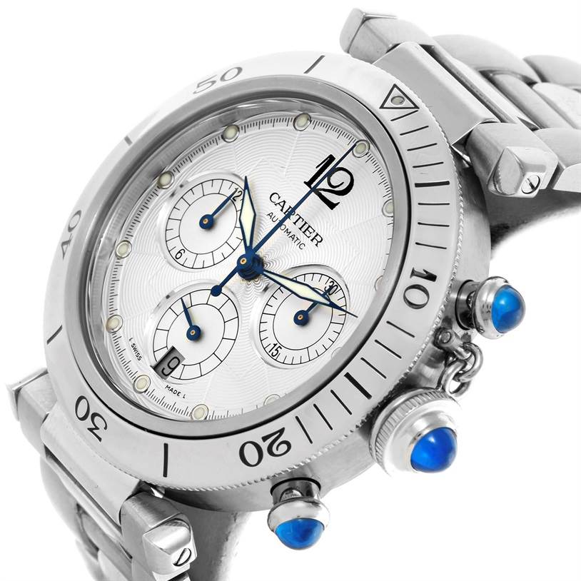 The Cartier Pasha W31030H3 Men
s Stainless Steel Silver Dial W31030H3 Men
s Stainless Steel Silver Dial watch is shown at an angled side view, featuring its dial, bezel, and blue-capped crown and pushers.