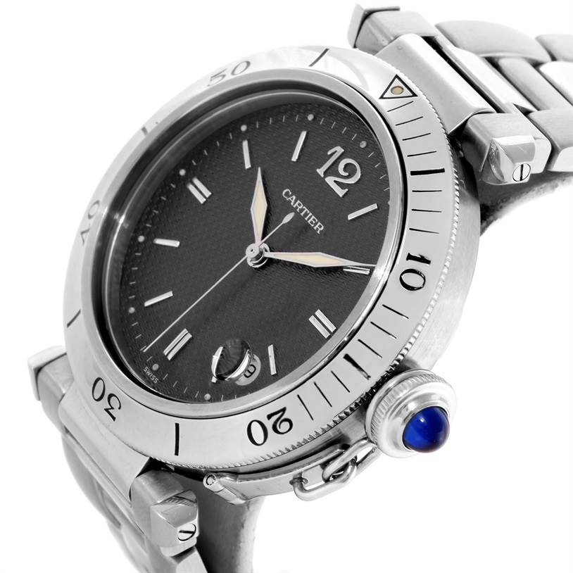 The image shows a close-up side angle of the Cartier Pasha W31017H3 Men's Stainless Steel Grey Dial W31017H3 Men's Stainless Steel Grey Dial watch, highlighting its bezel, dial, and crown with a blue cabochon.