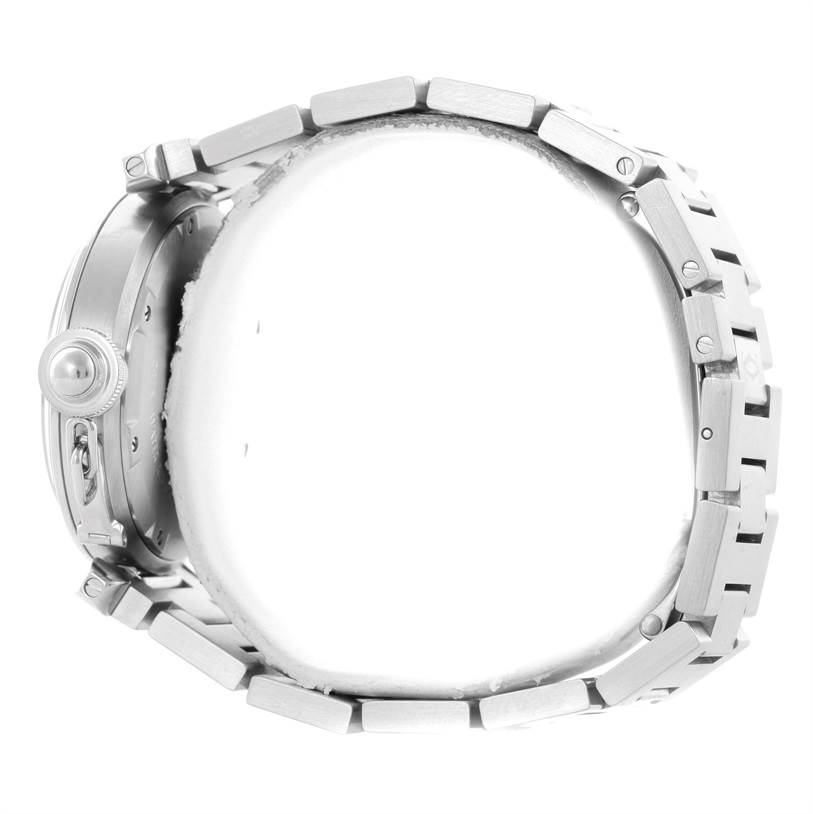 The image shows a side view of the Cartier Pasha W31055M7 Men's Stainless Steel White Dial W31055M7 Men's Stainless Steel White Dial watch, highlighting its crown and metal bracelet.