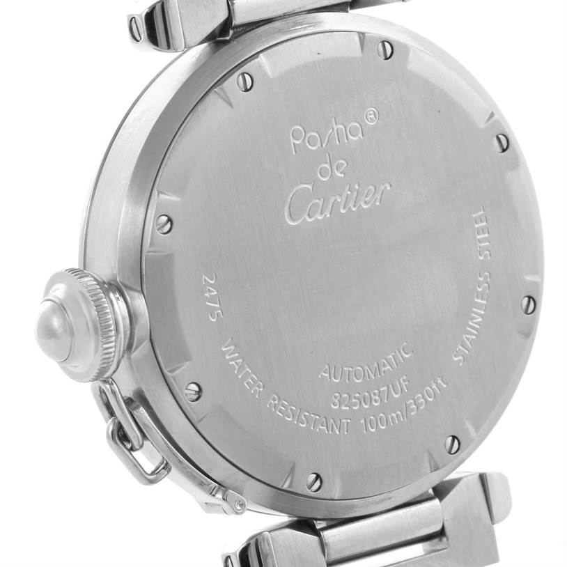 The image shows the back case of a Cartier Pasha W31055M7 Men's Stainless Steel White Dial W31055M7 Men's Stainless Steel White Dial model watch, displaying the engravings and part of the crown.